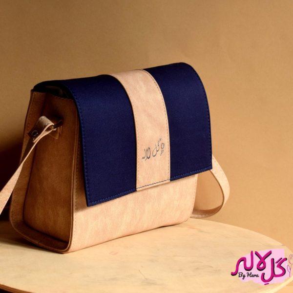 The Glam Bag - Cream Inspired by the energy and fervor of being on the go, we’ve created the everyday bag you’ve been dreaming of. The Glam Bag is a classic cross-body bag with a modern, smart-casual silhouette that is unexpectedly spacious. Featuring a strip of blue to give it a denim effect, adds the finishing touches! Locally made in Pakistan