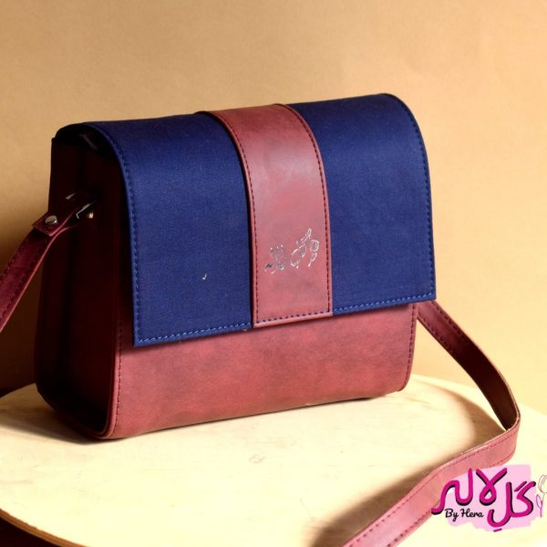 Inspired by the energy and fervor of being on the go, we’ve created the everyday bag you’ve been dreaming of. The Glam Bag is a classic cross-body bag with a modern, smart-casual silhouette that is unexpectedly spacious. Featuring a strip of blue to give it a denim effect, adds the finishing touches! Locally made in Pakistan