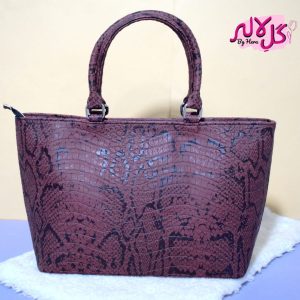 Brown Viper - Faux Leather Hand Bag A shiny beautiful handbag with a chic snake print. Featuring a simple & popular silhouette, this bag is perfect to carry everything you need to have with you when on the go! Made out of faux leather with textured snake print to make it stand out and give it a contemporary touch!