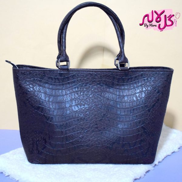 Black Cobra - Faux Leather Hand Bag A shiny beautiful handbag with a chic snake print. Featuring a simple & popular silhouette, this bag is perfect to carry everything you need to have with you when on the go! Made out of faux leather with textured snake print tomake it stand out and give it a desi touch!