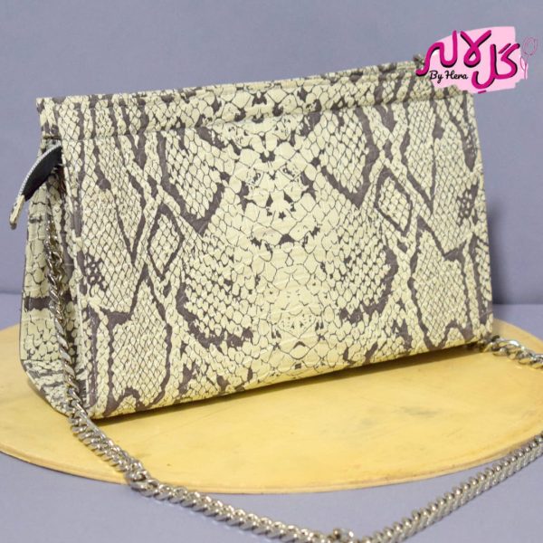 White Python - Mini - Faux Leather Chain Bag A shiny beautiful chained bag featuring a snake print. Having a simple & popular silhouette, this bag is perfect to carry everything you need to have with you when on the go! Made out of faux leather with textured snake print to make it stand out and give it a contemporary touch!