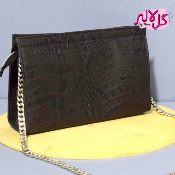 Black Cobra - Mini - Faux Leather Chain Bag A shiny beautiful chained bag featuring a snake print. Having a simple & popular silhouette, this bag is perfect to carry everything you need to have with you when on the go! Made out of faux leather with textured snake print to make it stand out and give it a contemporary touch!